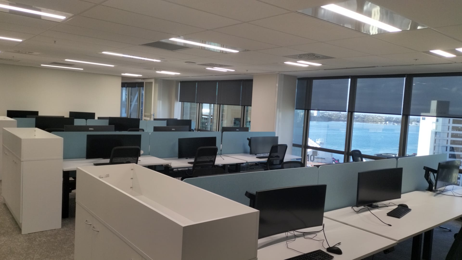 Finished Auckland CBD office workstation fit-out with harbour view by Cabling For U