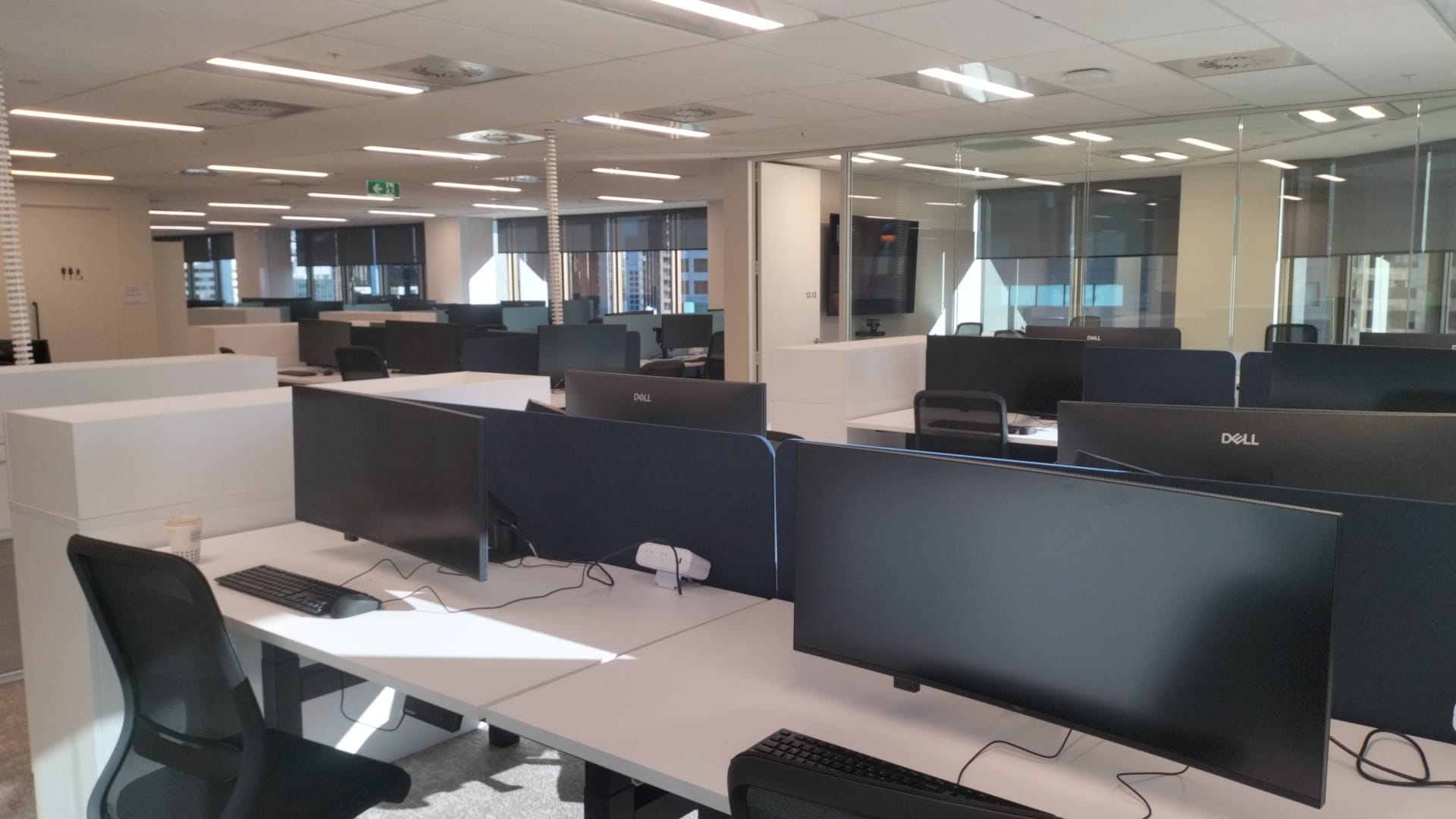 Open-plan office fit-out with meeting room in Auckland by Cabling For U