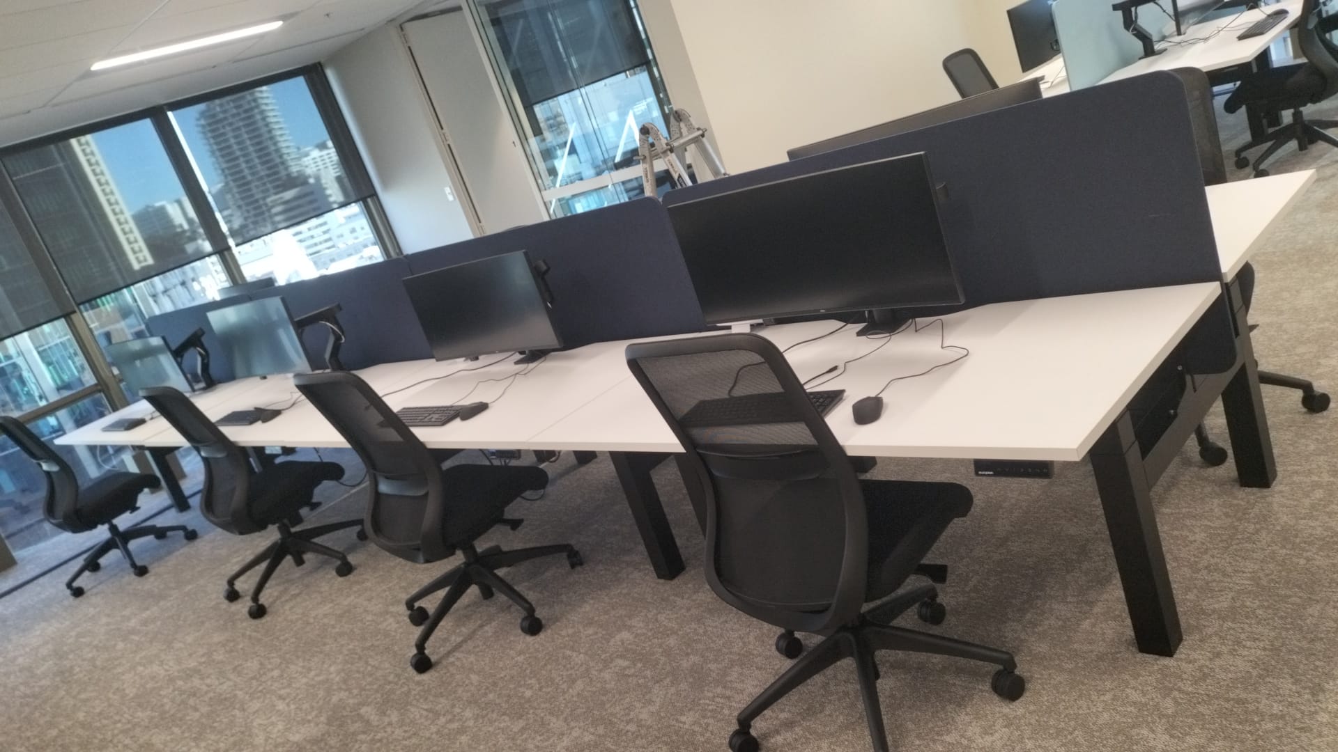 Dual monitor workstation on a single monitor arm set up by Cabling For U in Auckland