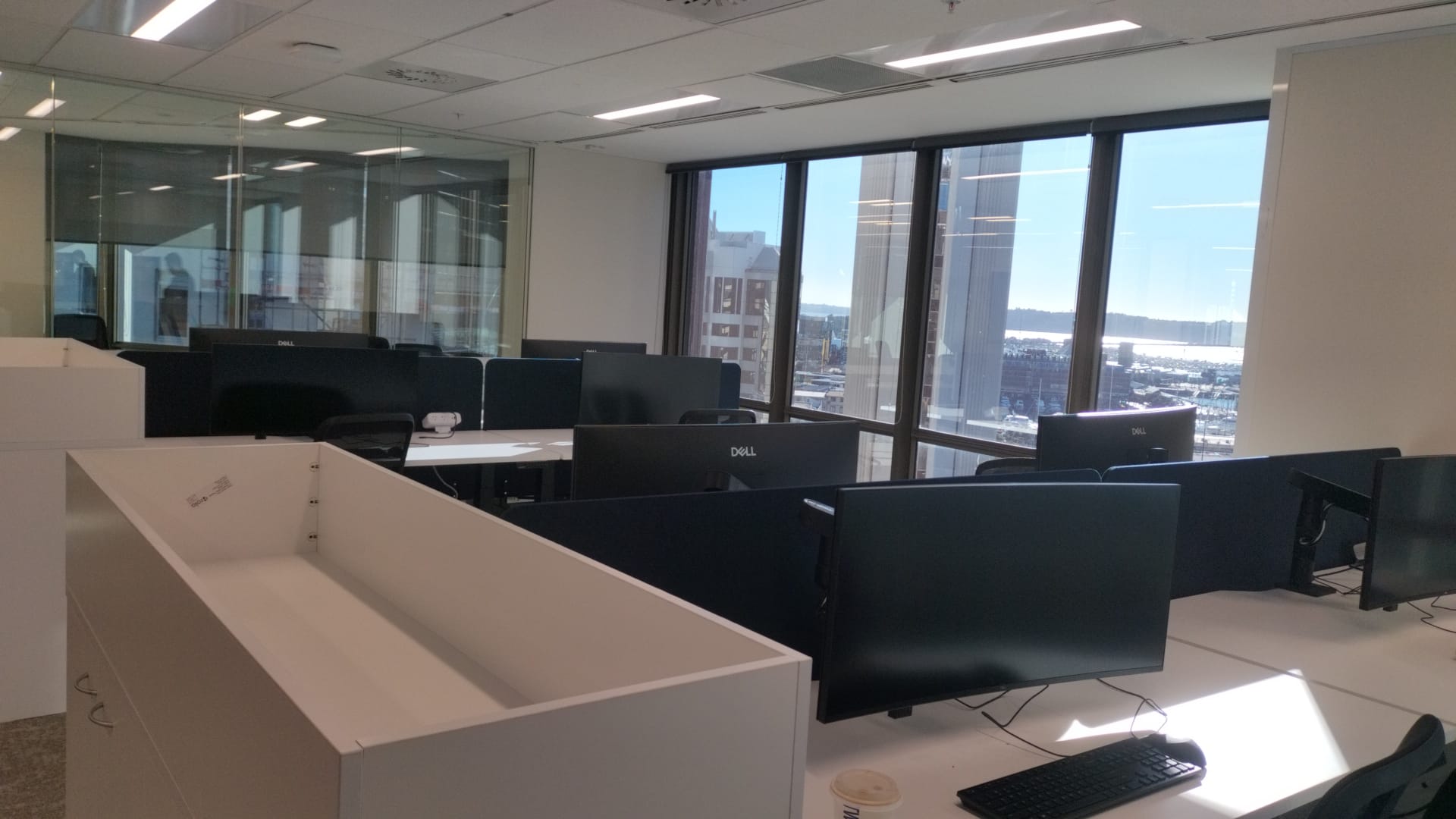 Completed open-plan office workstation fit-out in Auckland CBD by Cabling For U